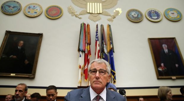 Defense Secretary Chuck Hagel prepares to testify before the House Armed Services Committee about the ongoing threat from the Islamic State of Iraq and the Levant (ISIL) during a hearing in the Rayburn House Office Building on Capitol Hill September 18, 2014 in Washington, DC. At the request of President Barack Obama, the House of Representatives passed legislation Wednesday that authorizes the training and arming of Syrian rebels to confront ISIL.  