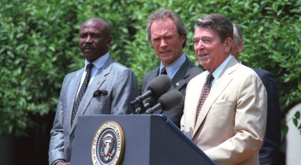 Louis Gossett Jr., Clint Eastwood and President Reagan speaking at a Take Pride in America event in the White House Rose Garden, July 21 1987