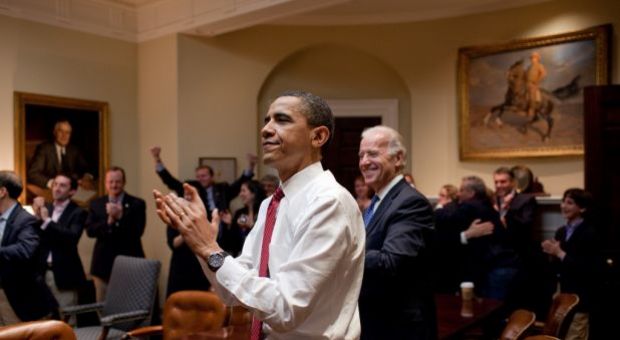 President Barack Obama, Vice President Joe Biden, and senior staff, react in the Roosevelt Room of the White House, as the House passes the health care reform bill, March 21, 2010.