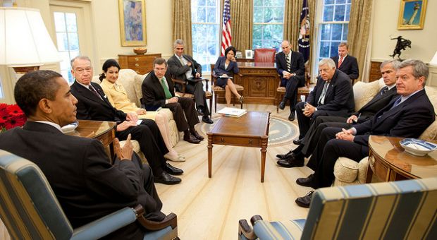 President Barrack Obama meets in the Oval Office with members of the Senate Finance Committee on Aug. 6, 2009