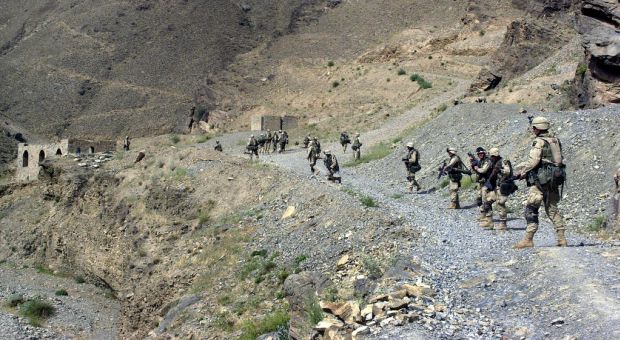 Soldiers from B Company 2-187 Infantry 101st Airborne Division (Air Assault) perform their sensitive sites exploitation (SSE) in an Afghan village near the Pakistan border (2002)