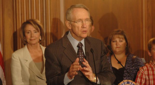 Senate Majority Leader Harry Reid (D-Nev.) with House Speaker Nancy Pelosi in the background at the signing ceremony for the Consumer Product Safety Improvement Act in 2008