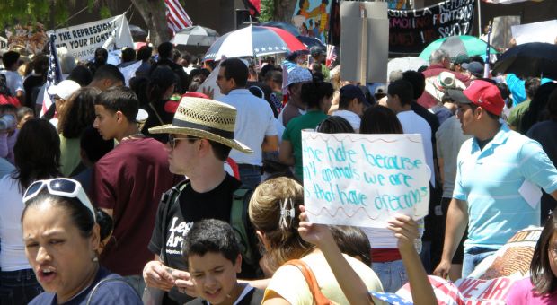 People protest Arizona's tough new anti-immigration law outside the state's Capitol building, April 25 2010