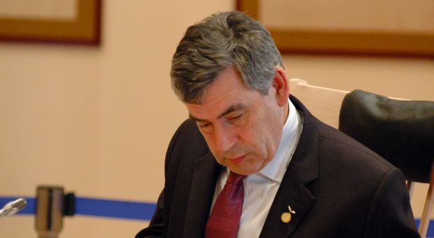 British Prime Minister Gordon Brown preparing notes before the 2008 G8 meeting