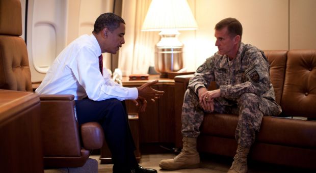 President Barack Obama meets with Army Gen. Stanley McChrystal, the Commander of U.S. Forces in Afghanistan, aboard Air Force One in Copenhagen, Denmark on Oct. 2, 2009.