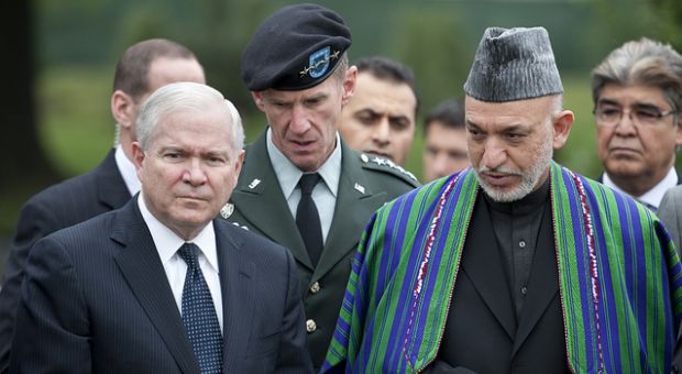 From left, Secretary of Defense Robert M. Gates and Gen. Stanley McChrystal, commander of NATO's International Security Assistance Force, escort Afghan President Hamid Karzai on a tour of Arlington National Cemetery's Section 60 May 13, 2010.