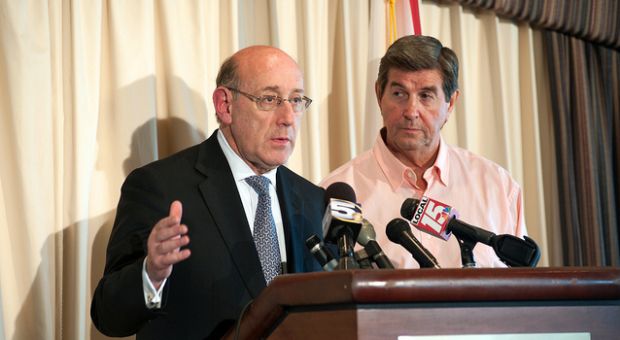 Governor Bob Riley and Kenneth Feinberg (black suit) discuss a quicker way to help disperse the allocated funds at a press conference at Cotton Creek Club in Gulf Shores, AL. 01 July 2010