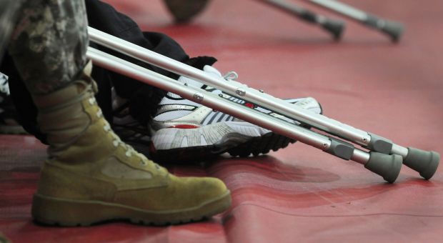 U.S. Soldiers who are wounded, ill or injured attend a Warrior Transition Brigade event at Walter Reed Army Medical Center in Washington, D.C., Jan. 27, 2010. During the event, NASA astronaut and retired Army Col. Patrick G. Forrester presented the Warrior Transition Brigade flag that was flown over the International Space Station to the Soldiers for their military service.