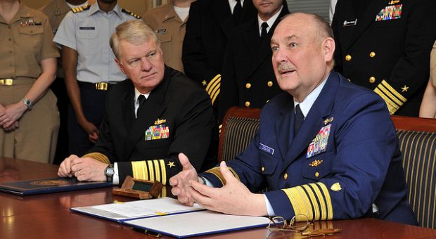 Chief of Naval Operations (CNO) Adm. Gary Roughead and Coast Guard Commandant Adm. Thad W. Allen sign a memorandum of
agreement (MOA) for the Safe Harbor program at the Pentagon, April 2009